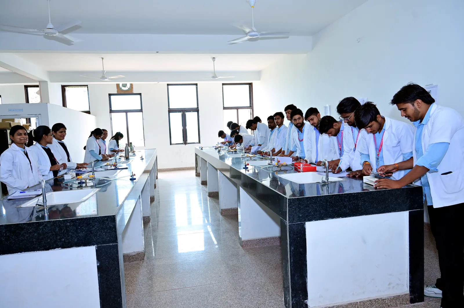 Students participating in a supervised laboratory session at MGGC Sikar